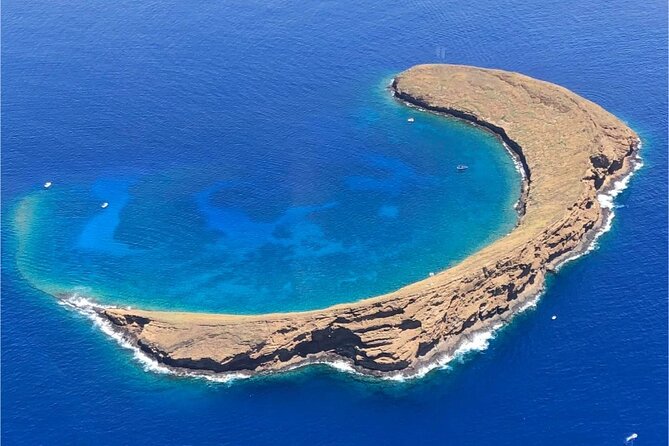 Maui: Molokini Crater and Turtle Town Snorkeling From Kihei - Boarding a small boat from Kihei