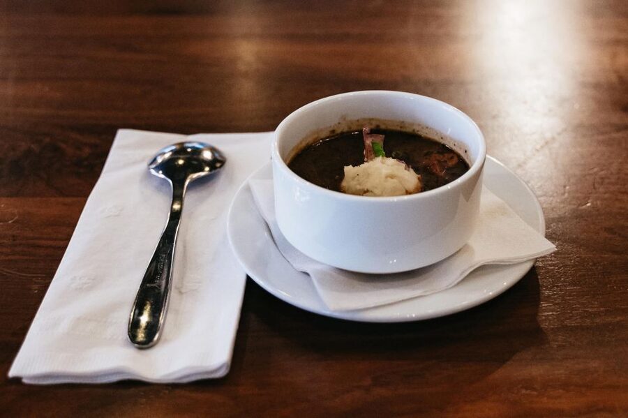 New Orleans: French Quarter Food History Walking Tour - Ending with bananas Foster bread pudding
