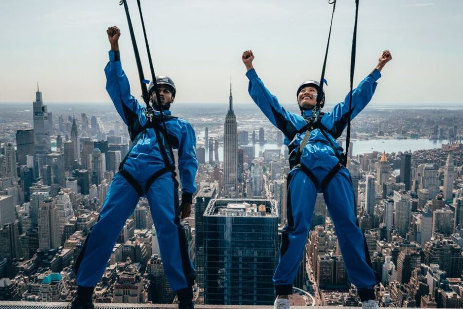 NYC: City Climb Skyscraping Experience Ticket - Leaning out above New York City