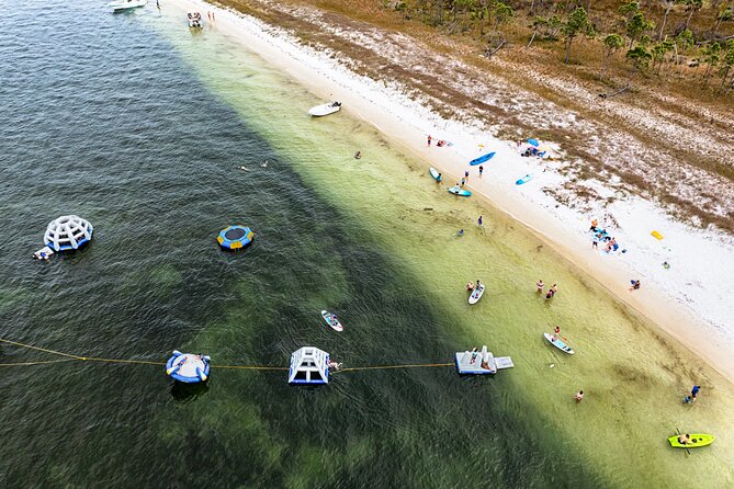 Shell Island Inflatable Adventure Park & Dolphin Sightseeing Tour - Inflatables, kayaks, paddleboards, and snorkeling