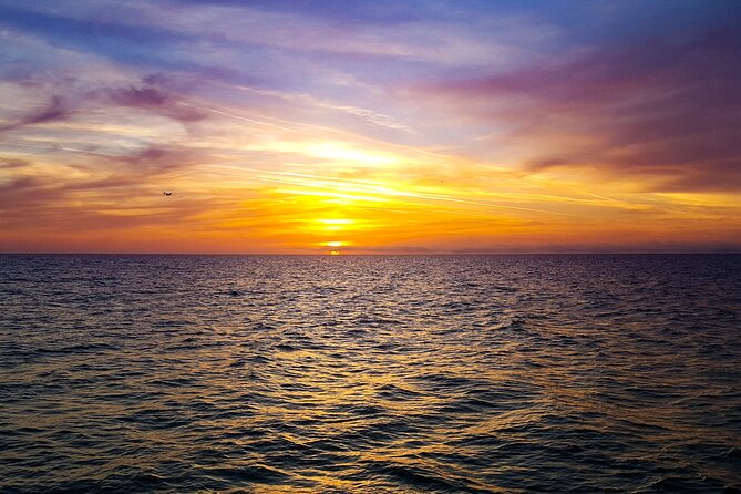 Sunset Celebration Cruise on Tropics Boat Tours - Champagne, bar service, and the evening mood