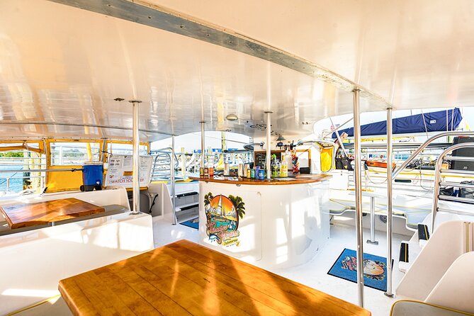 Sunset Dolphin Sail Aboard the Privateer Catamaran - Music, drinks, and the onboard bar