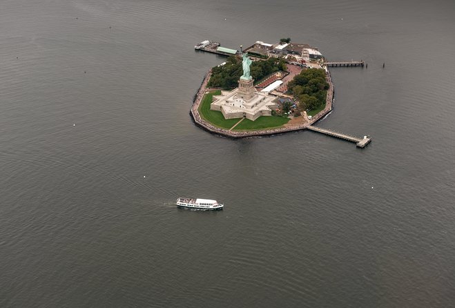 The Manhattan Helicopter Tour of New York - Lower Manhattan from the air: One World Trade Center and the Statue of Liberty